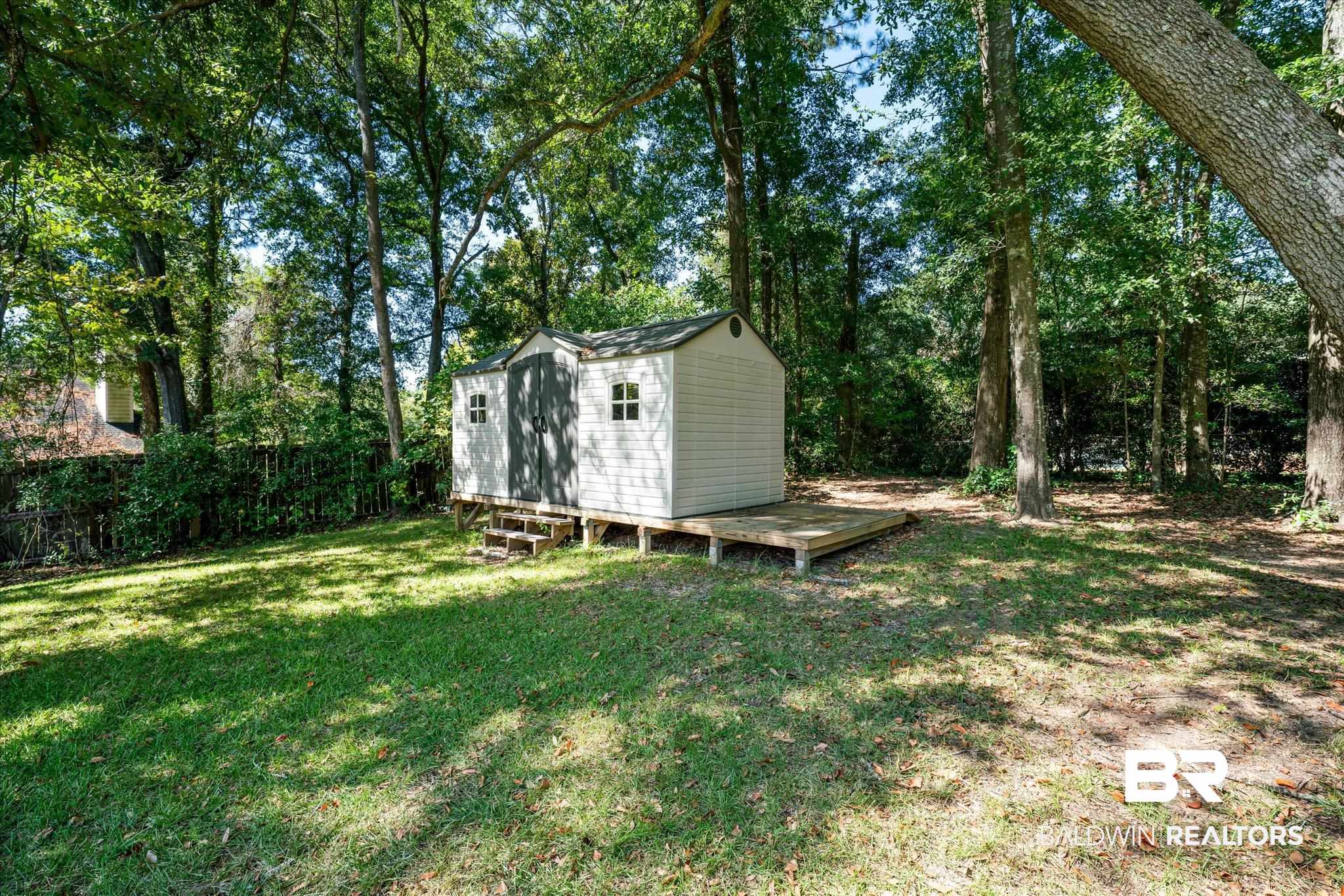 113 Pineridge Road Daphne, AL 36526 - Photo 21 of 22 View of yard featuring a storage unit