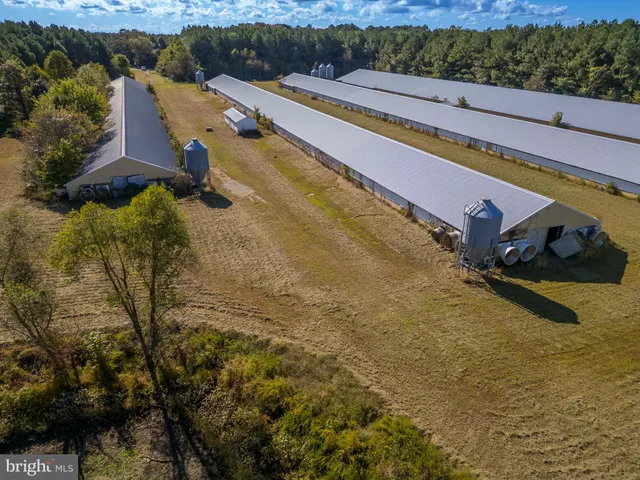 an aerial view of a house with pool patio and outdoor seating