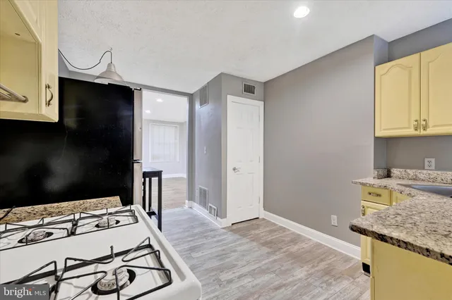 a kitchen with a stove and a microwave