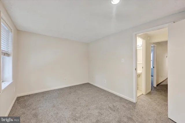 an empty room with a bathroom