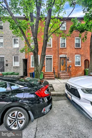 a car parked in front of a house