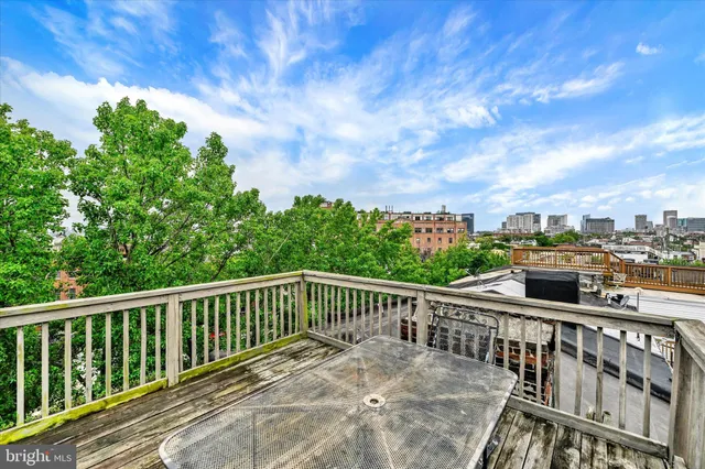 a view of a balcony with trees