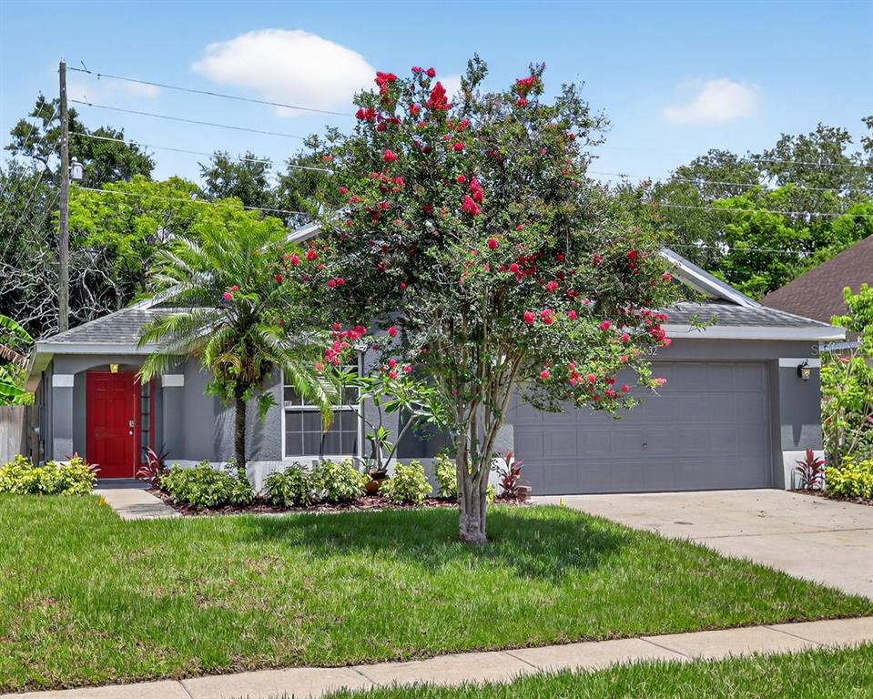 632 Bridge Creek Boulevard Ocoee, FL 34761 - Photo 1 of 1 a front view of a house with a yard and a garden