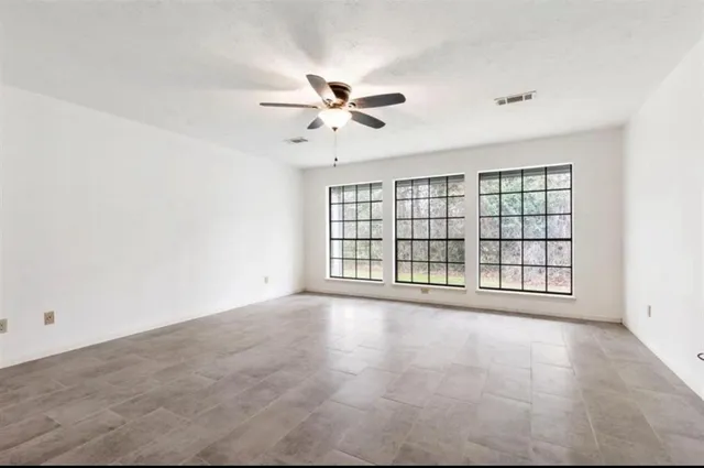 a bathroom with double sink and a mirror