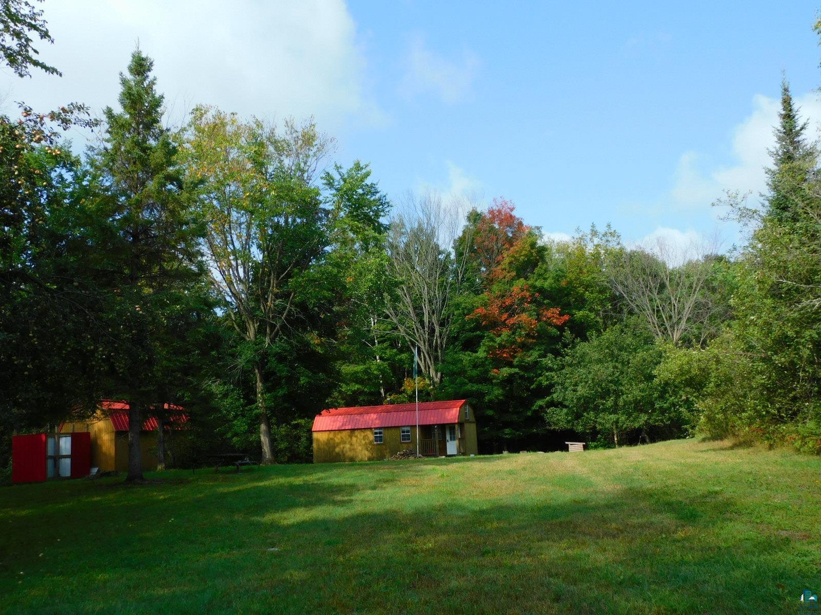 Two cabins & storage shed on 20 acres