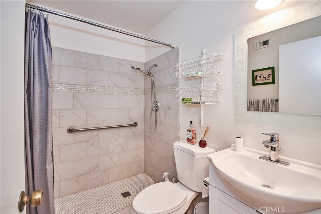 20309 East Vejar Road Walnut, CA 91789 - Photo 15 of 29 a bathroom with a sink toilet and shower