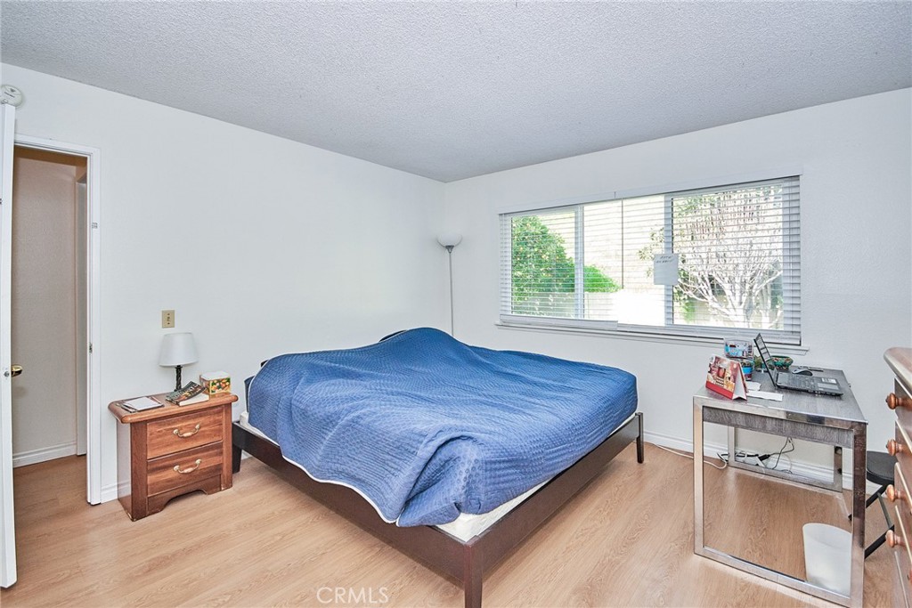 20309 East Vejar Road Walnut, CA 91789 - Photo 20 of 29 a bed sitting in a bedroom next to a window