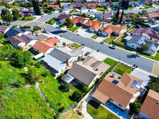 an aerial view of house with a yard