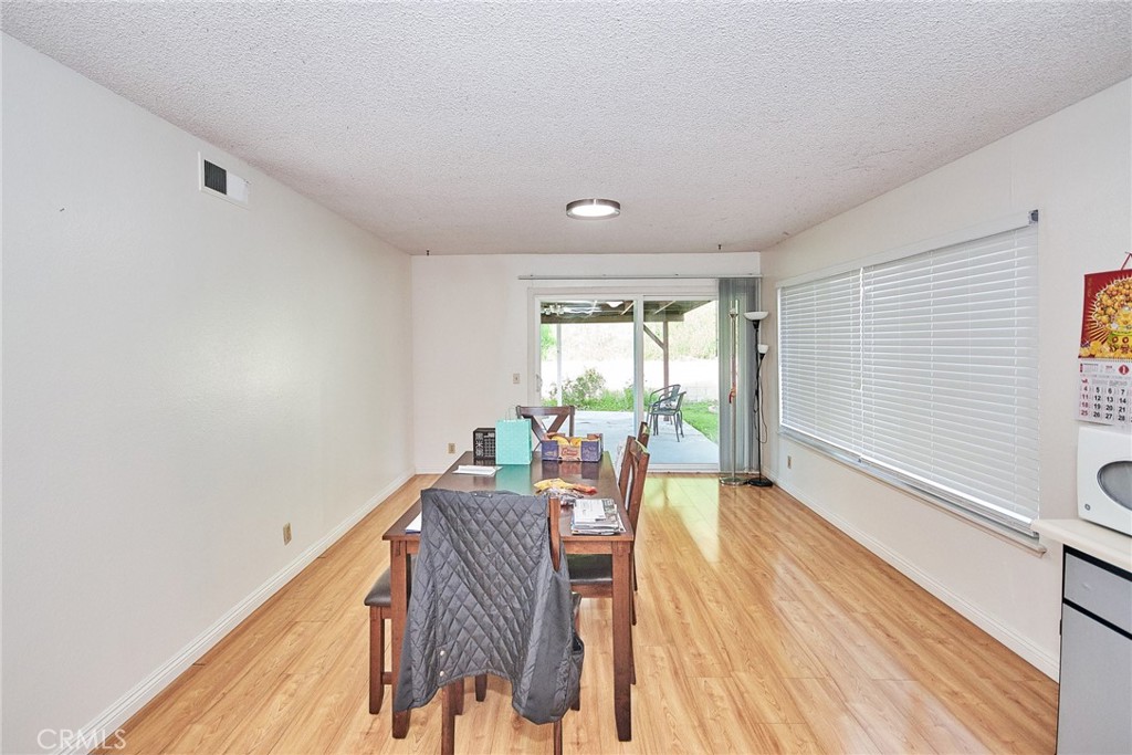20309 East Vejar Road Walnut, CA 91789 - Photo 10 of 29 a view of a room with wooden floor and furniture