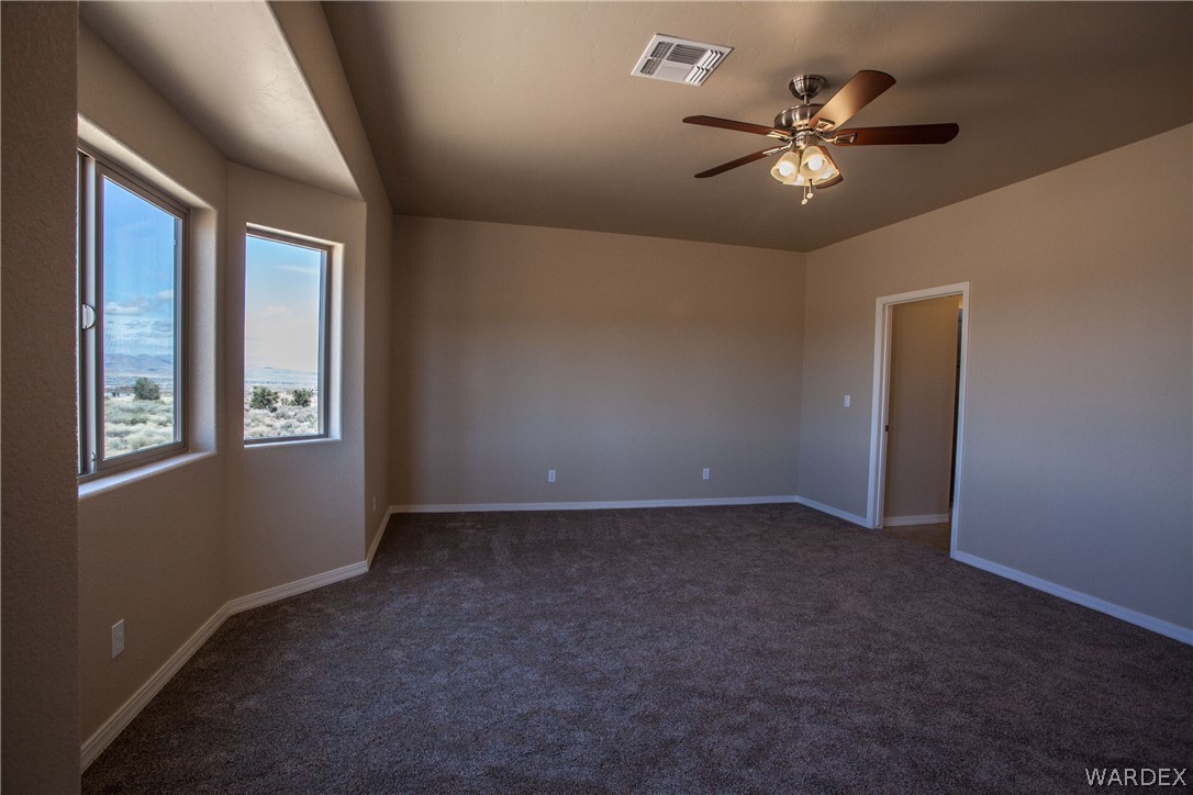 4861 North Neal Ranch Road Kingman, AZ 86401 - Photo 24 of 36 a view of an empty room with a window