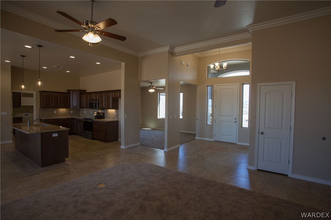 4861 North Neal Ranch Road Kingman, AZ 86401 - Photo 3 of 36 a view of an empty room and kitchen view