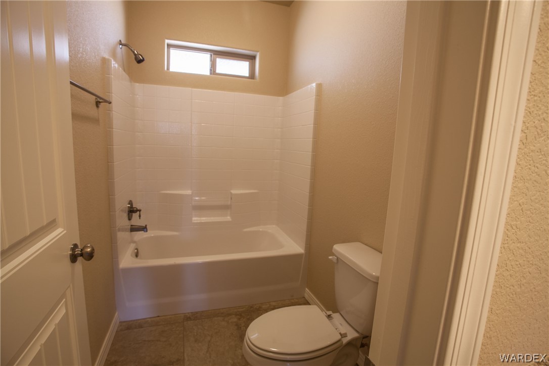 4861 North Neal Ranch Road Kingman, AZ 86401 - Photo 36 of 36 a bathroom with a toilet and a shower