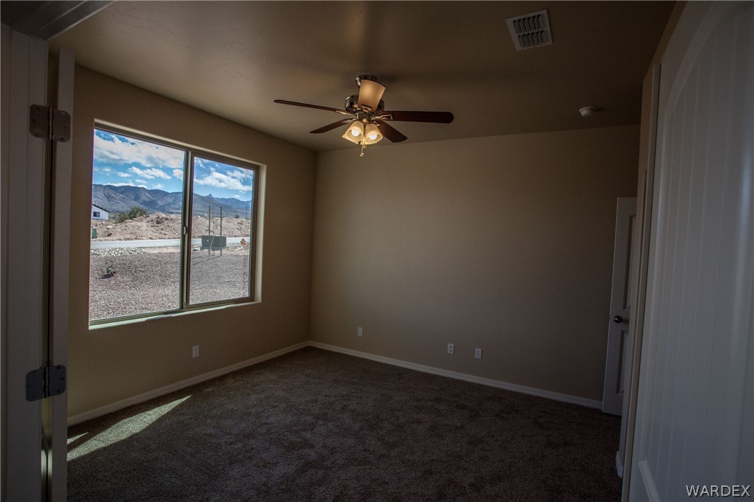 4861 North Neal Ranch Road Kingman, AZ 86401 - Photo 8 of 36 an empty room with a window