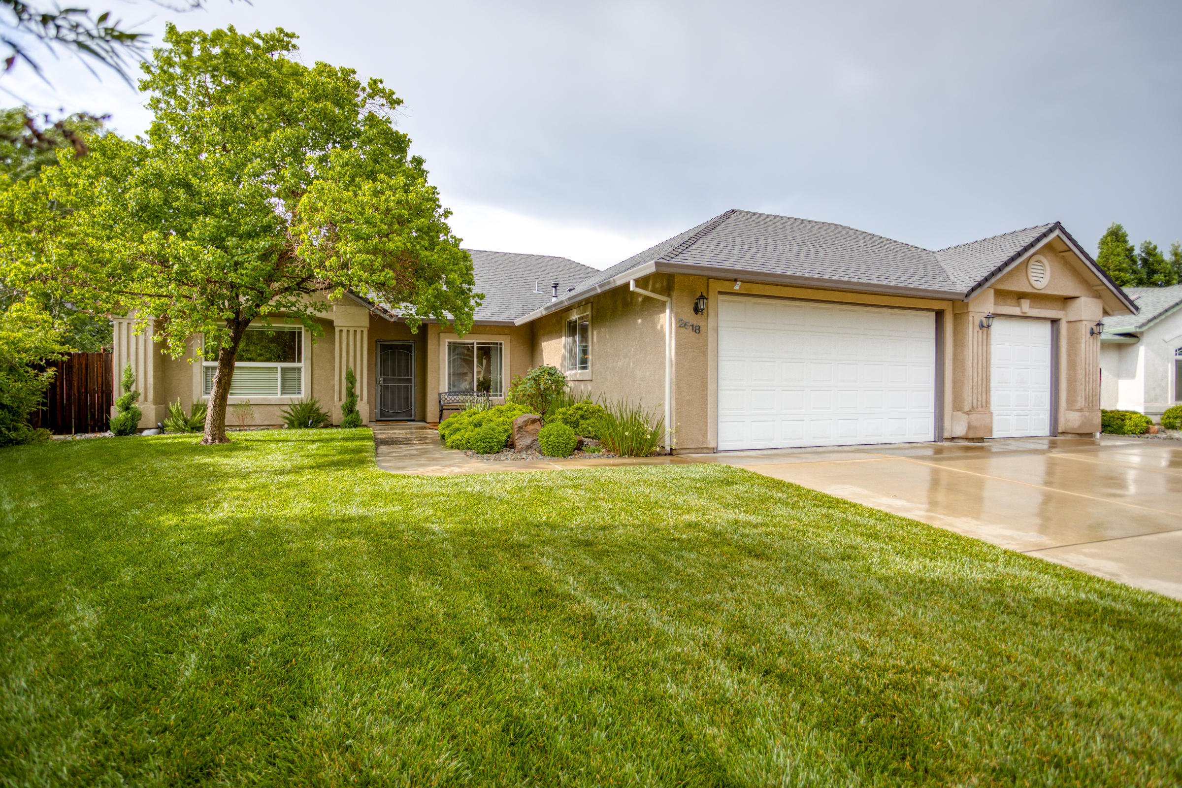 2618 Rhinestone Way Redding, CA 96001 - Photo 1 of 58 a front view of house with yard and trees