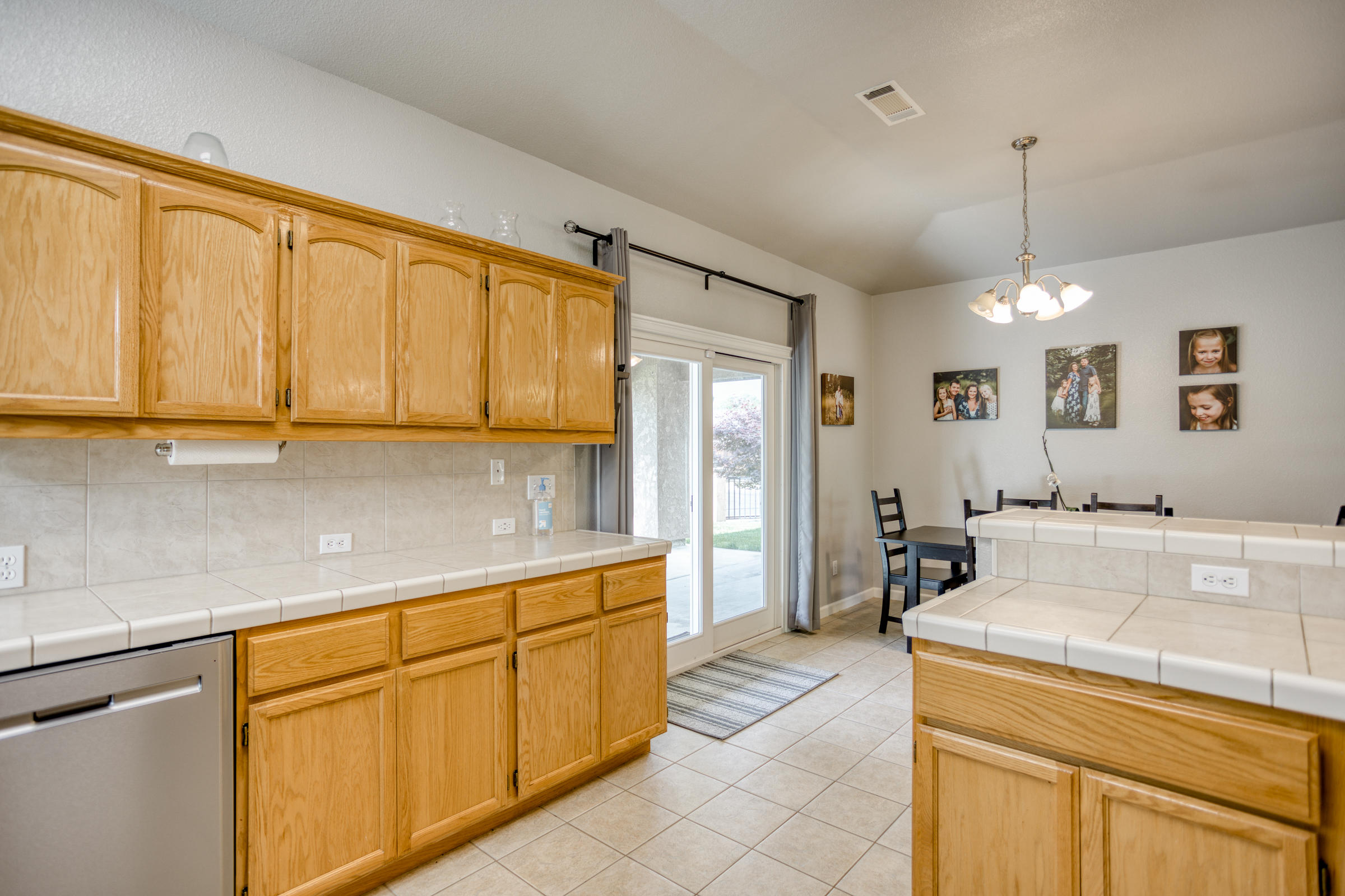 2618 Rhinestone Way Redding, CA 96001 - Photo 15 of 58 a kitchen with a sink stove and refrigerator