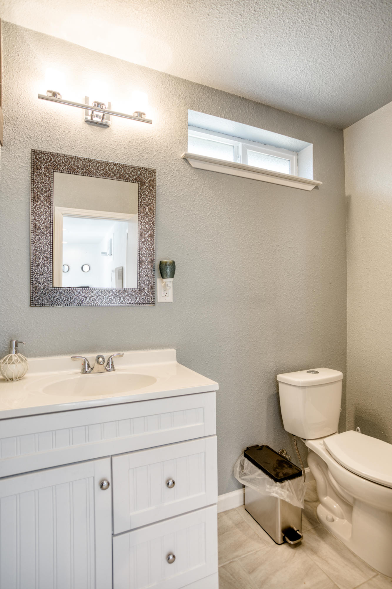 2618 Rhinestone Way Redding, CA 96001 - Photo 43 of 58 a bathroom with a sink a mirror and a toilet