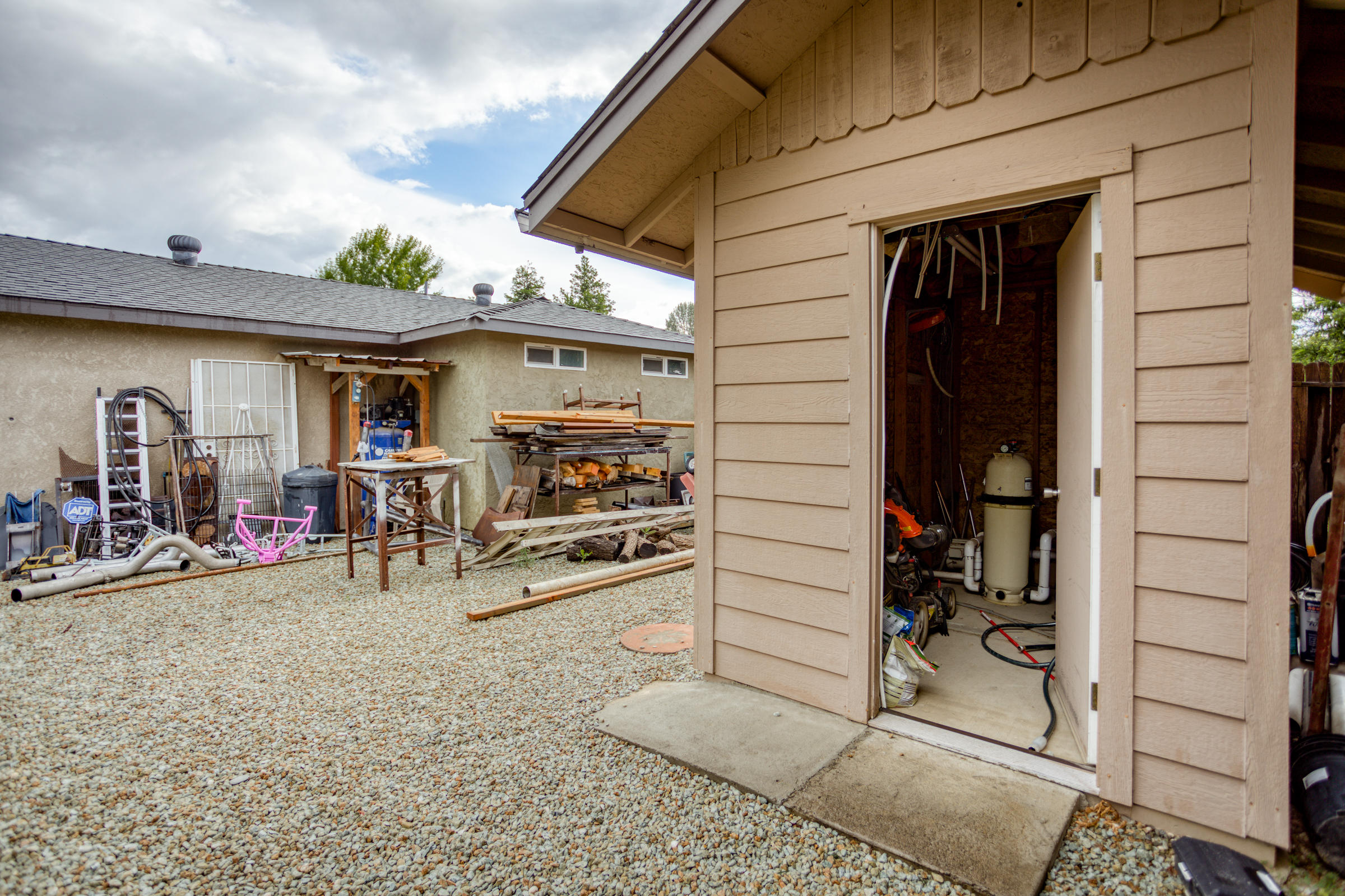 2618 Rhinestone Way Redding, CA 96001 - Photo 57 of 58 a view of a porch with table and chairs