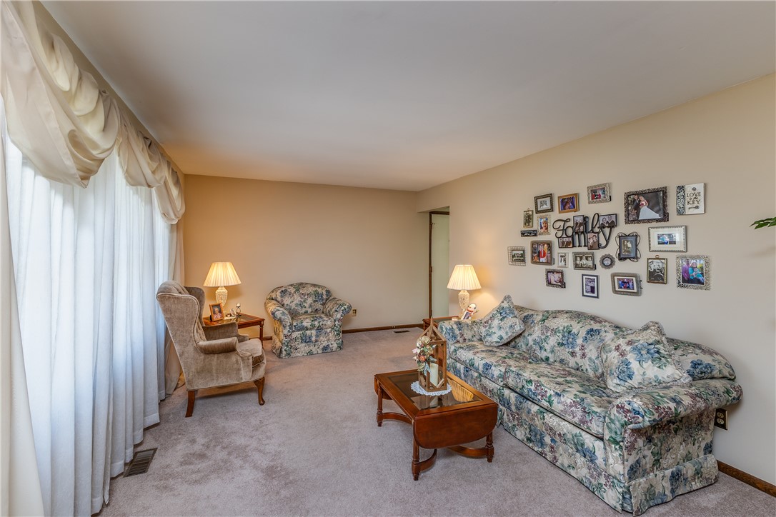 4210 Pleasanton Road Englewood, OH 45322 - Photo 5 of 34 This inviting space features soft carpeting and ample natural light, perfect for comfortable living.