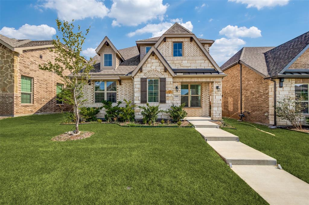 1448 Sun Gdn Way Justin, TX 76247 - Photo 1 of 15 Stone and brick facade with gabled dormers