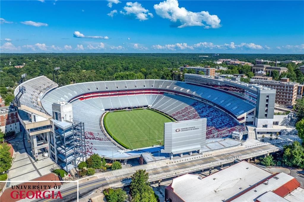 Lot 5 Stewart Loop Commerce, GA 30529 - Photo 12 of 12 a view of a balcony with floor to ceiling windows and outdoor kitchen