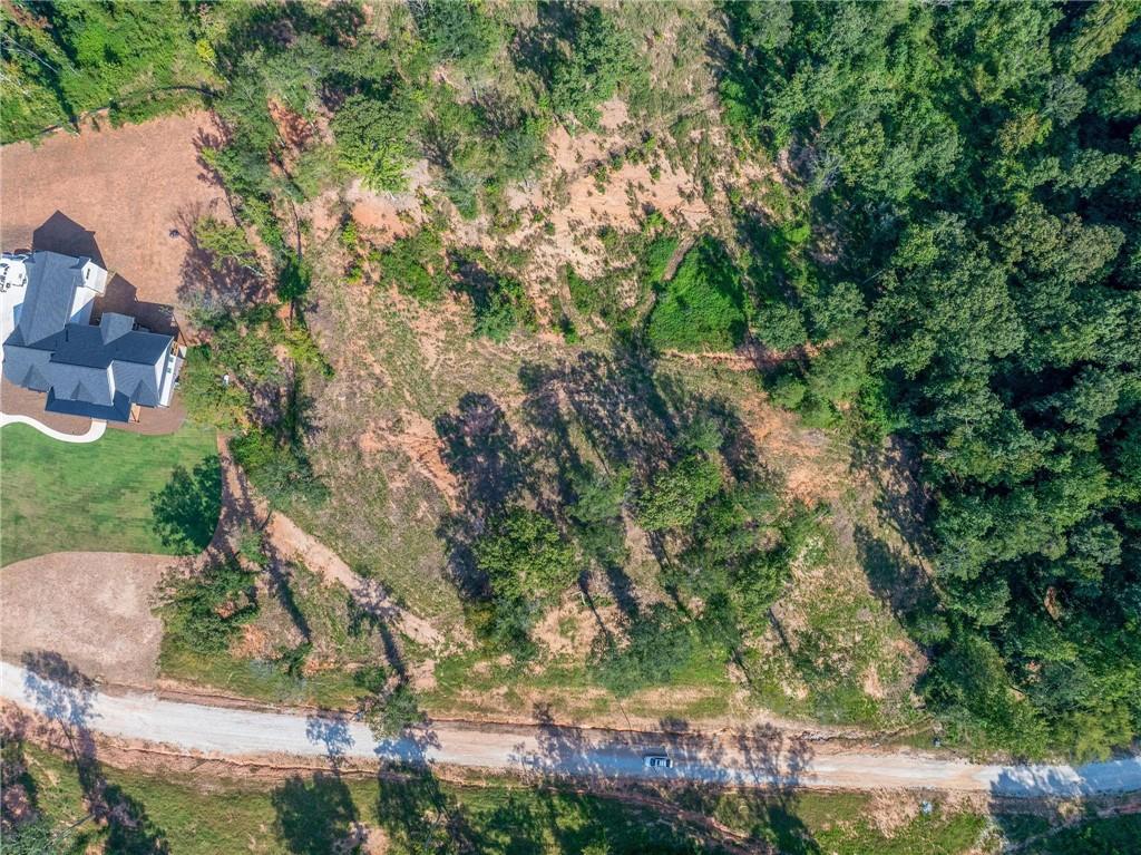 Lot 5 Stewart Loop Commerce, GA 30529 - Photo 6 of 12 an aerial view of residential house with outdoor space and trees all around