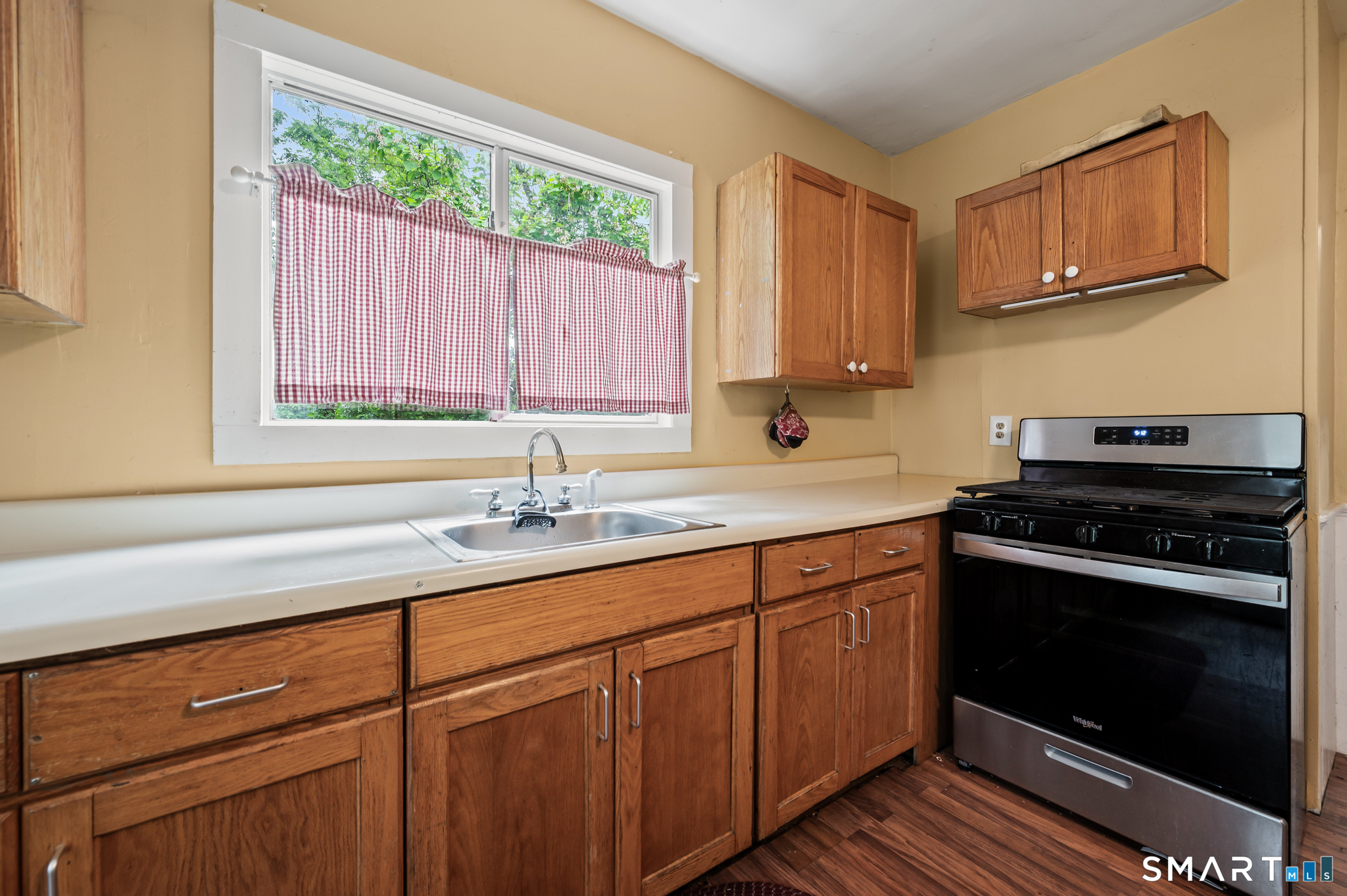 220 Murray Street Meriden, CT 06450 - Photo 7 of 28 a kitchen with stainless steel appliances granite countertop a sink stove and cabinets