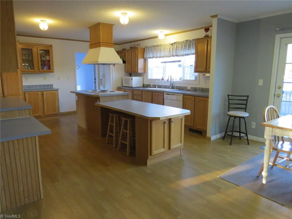 121 Alcorn Loop Ruffin, NC 27326 - Photo 8 of 19 Kitchen has island with bar area