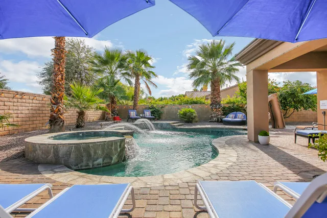 a view of a chairs and table in patio