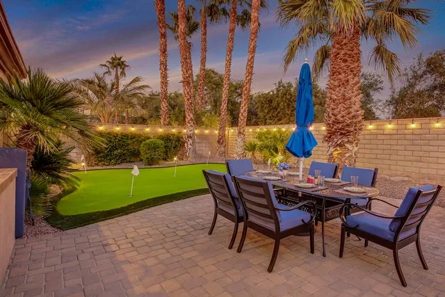 a living room with fireplace furniture and a wooden floor