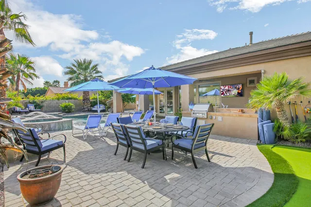 a living room with furniture or couch and a ceiling fan