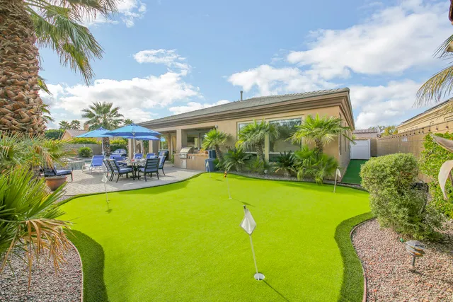 a living room with furniture kitchen view and a fireplace