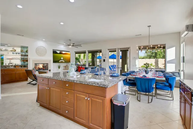 a spacious bathroom with a double vanity sink a mirror and a shower