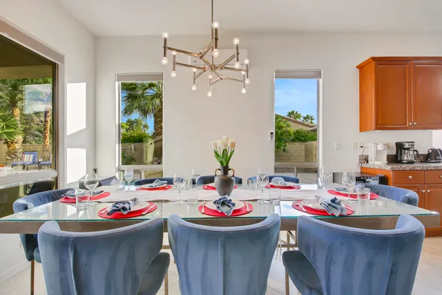 a bedroom with a bed and a potted plant