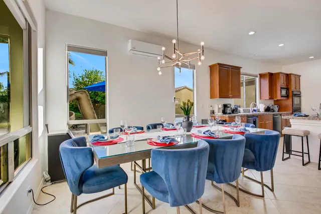 a view of a bedroom with furniture and wooden floor