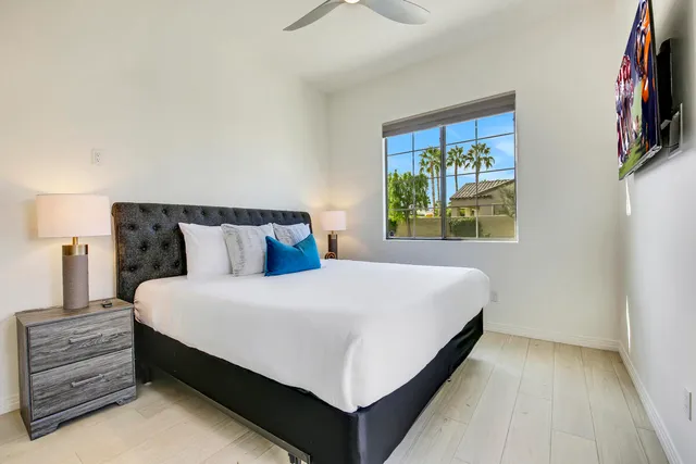 an aerial view of a house with swimming pool and yard