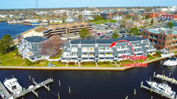 an aerial view of a house with a lake view