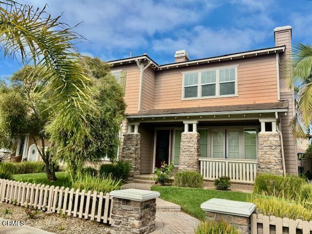 4153 Caribbean Street Oxnard, CA 93035 - Photo 1 of 22 a front view of a house with a garden
