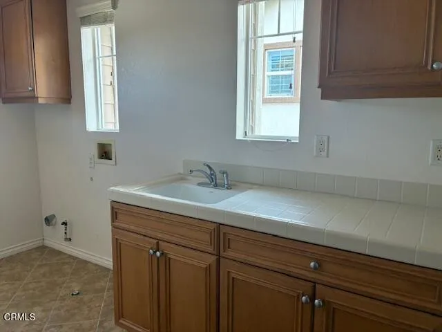 a bathroom with a sink a vanity and a window