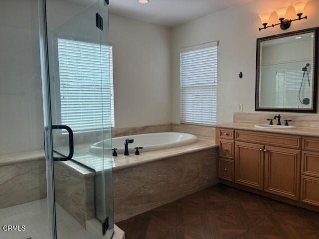 4153 Caribbean Street Oxnard, CA 93035 - Photo 16 of 22 a bathroom with a tub sink and mirror
