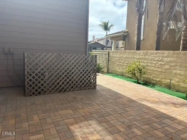 a view of a wooden door and a yard