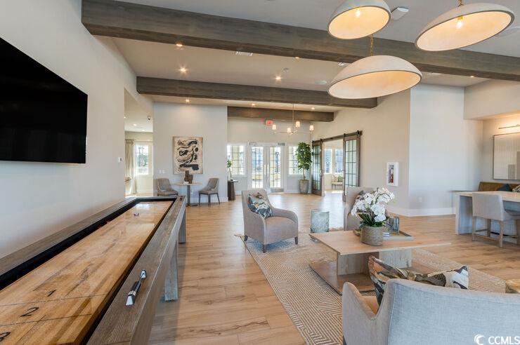 8840 Henry Road, Unit DEWBERRY Longs, SC 29568 - Photo 21 of 29 Living area featuring light wood finished floors, beamed ceiling, recessed lighting, and baseboards
