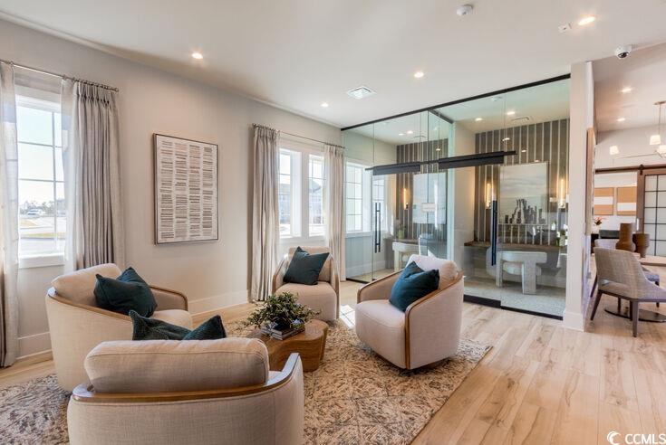 8840 Henry Road, Unit DEWBERRY Longs, SC 29568 - Photo 24 of 29 Living room featuring light wood-style flooring, plenty of natural light, recessed lighting, and baseboards