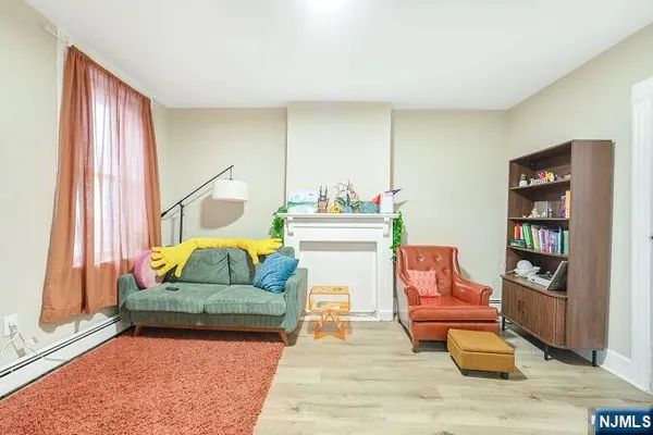 a bedroom with a bed closet and a mirror