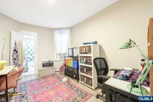 a kitchen with stainless steel appliances granite countertop white cabinets a sink and dishwasher with wooden floor