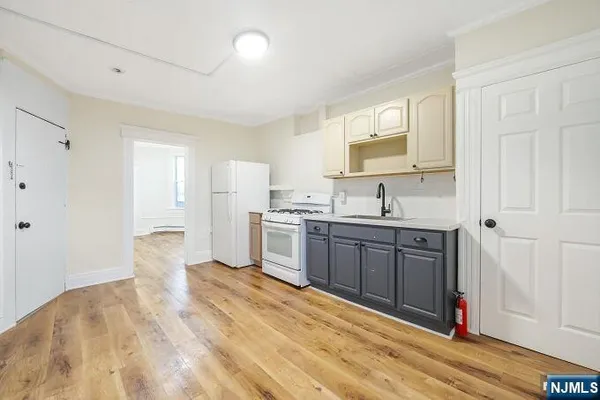 a bathroom with a sink a toilet and a shower