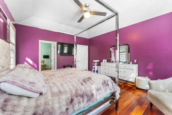 a bed room with a bed and a mirror