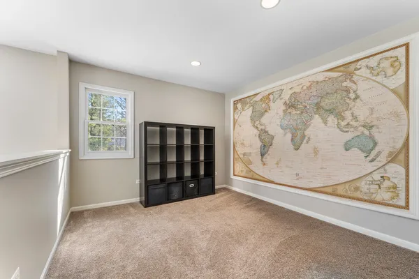 an empty room with a window and closet