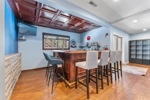 a view of a dining room with furniture and wooden floor