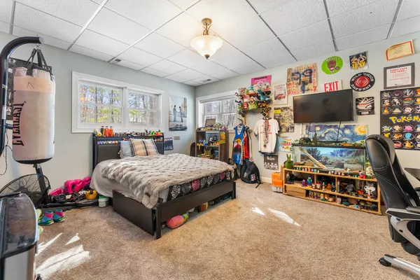 a bedroom with bed and window