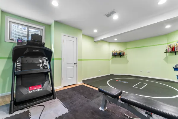 a room with pool table and a fireplace